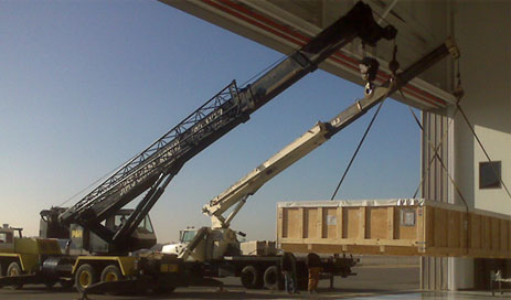 cranes lifting crates